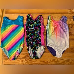 Lot of 3 gymnastics leotards. Sz 130 CM